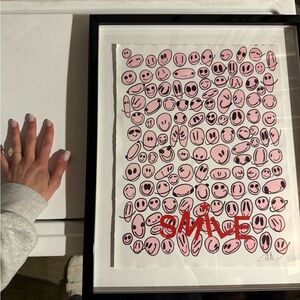 Pink smiley face framed print